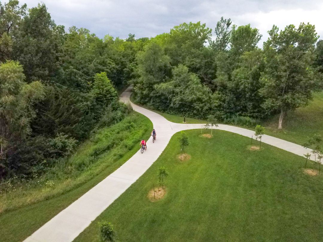 Aerial view of paved trail shows it's connectivity to Huxley's trail system